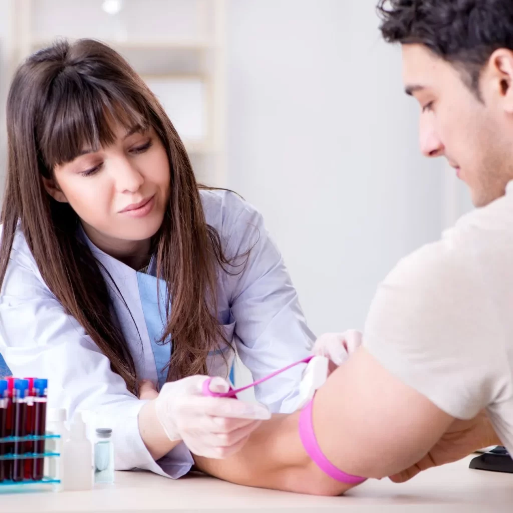 Nurse performing blood work services on a patient