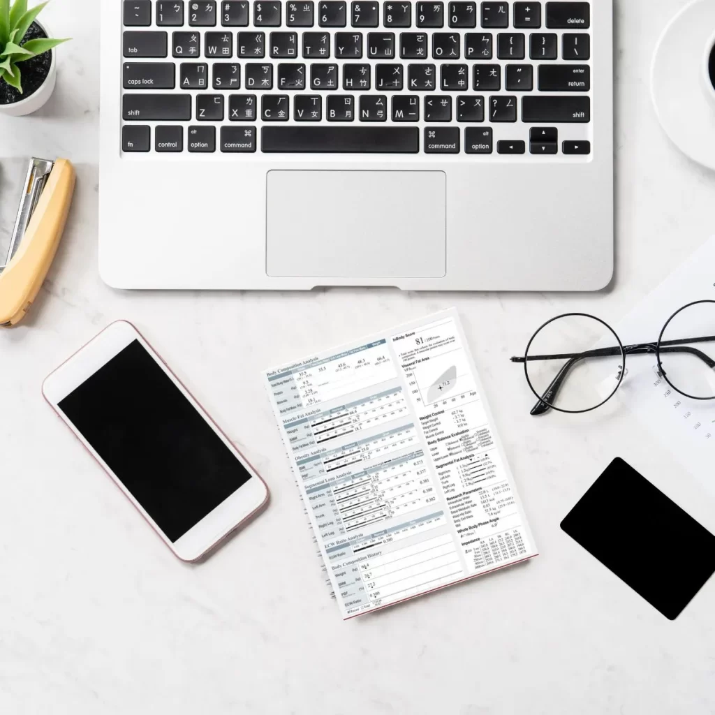 Body composition analysis sheet on a white desk