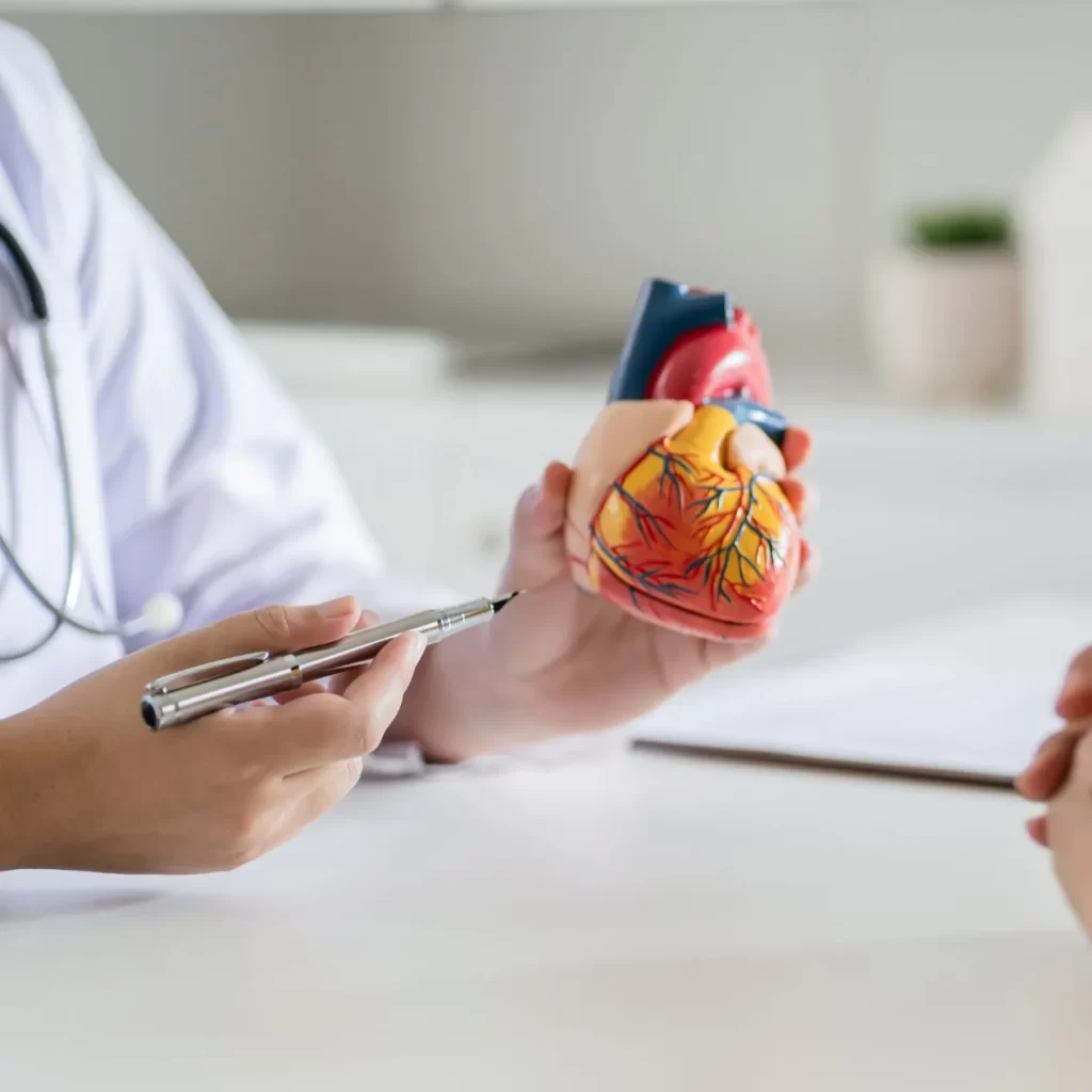 Medical doctor teaching patient about cardiology