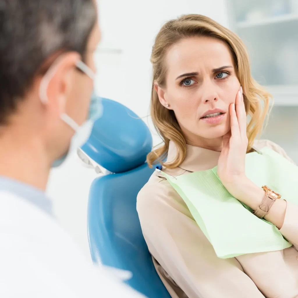 Woman with a dental emergency visiting an emergency care center