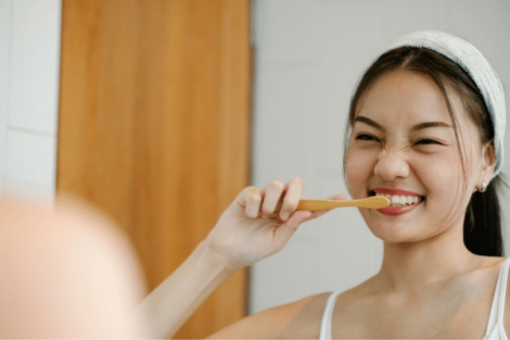 Woman brushing her teeth for a whiter smile