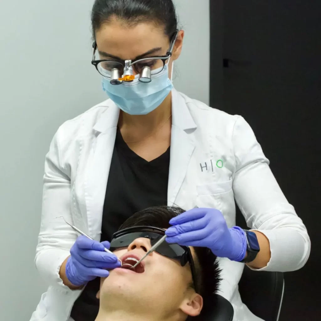 Dentist performing assessment for oral implants