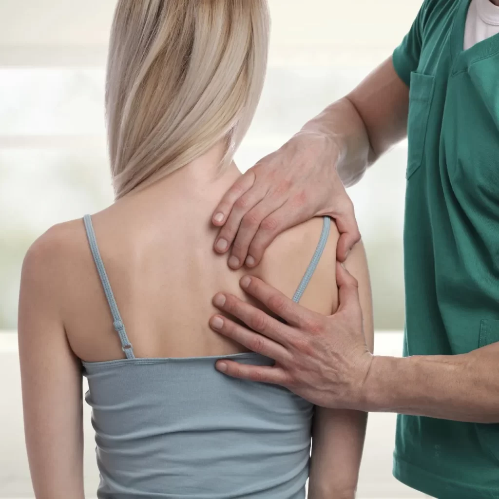 Release therapy on a woman's shoulder