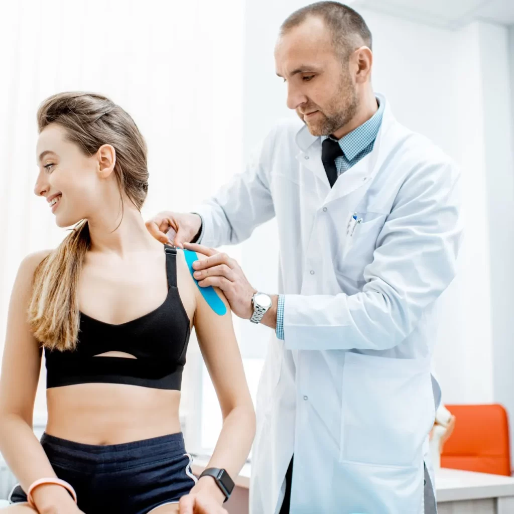 Kinesiologist assessing a patient with injury