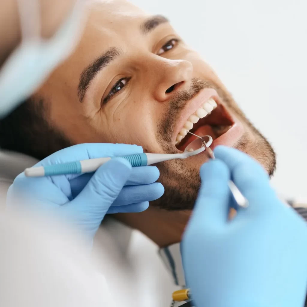 Man at dental appointment for wisdom teeth removal