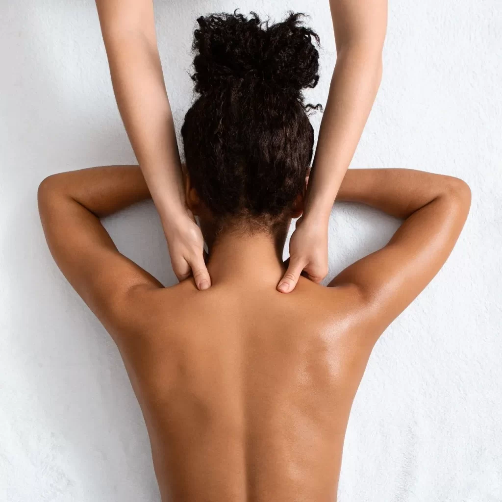 Massage therapist professional performing a massage