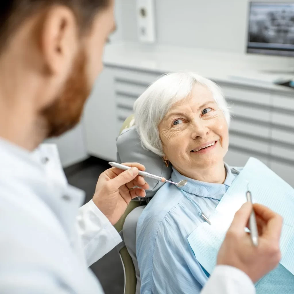 Old woman receiving care from emergency dentist