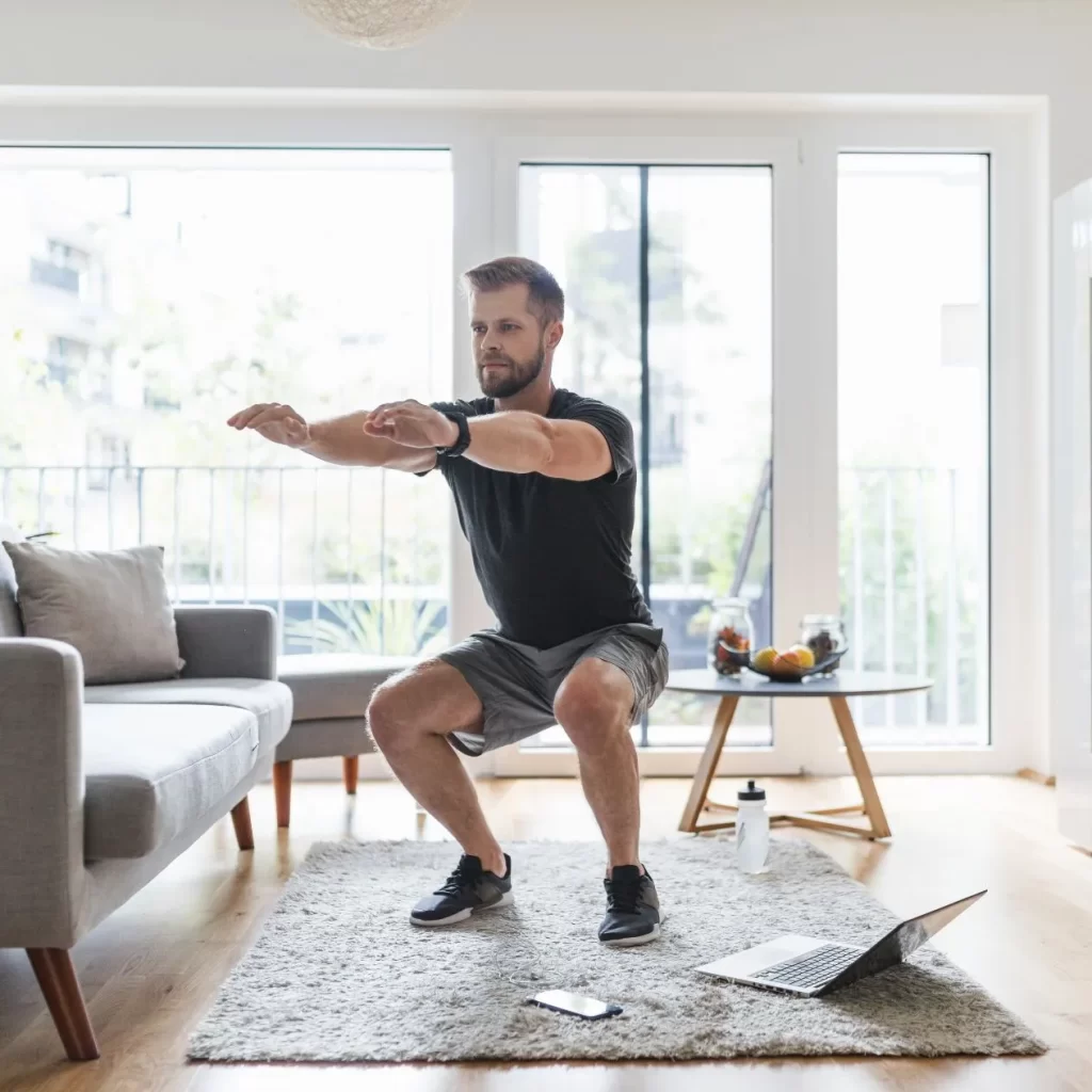 Man working out at home using custom program