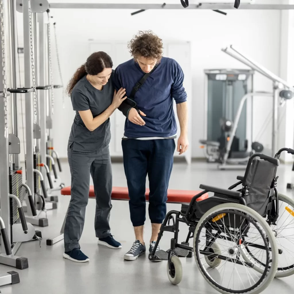 Man with injuries learning to walk post surgery