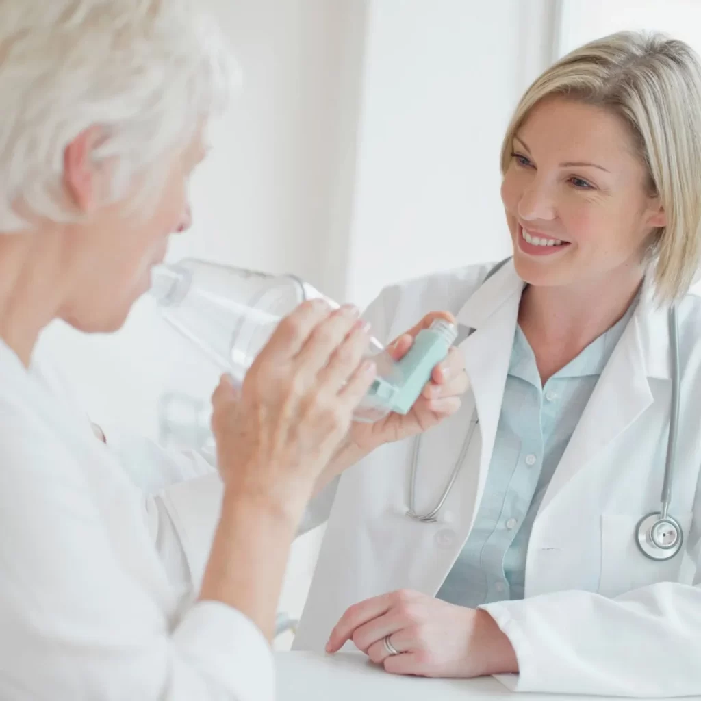 Respirologist helping a patient with breathing issues