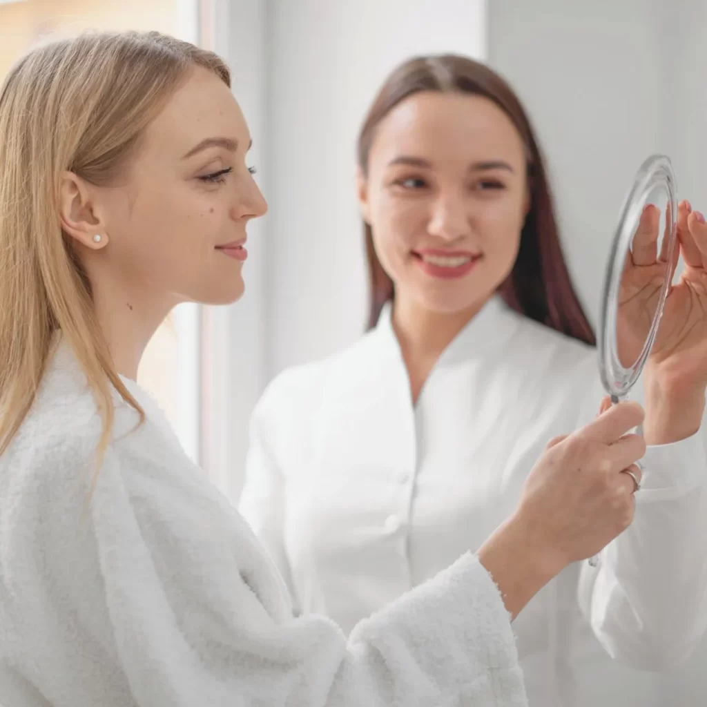 Woman getting a skin assessment from a Cosmetic Physician