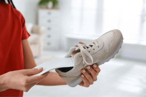 custom orthotics for exercise being put into a shoe