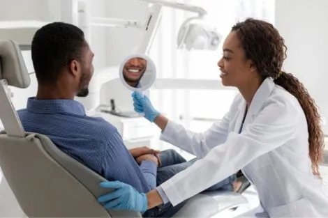 Dentist and smiling patient