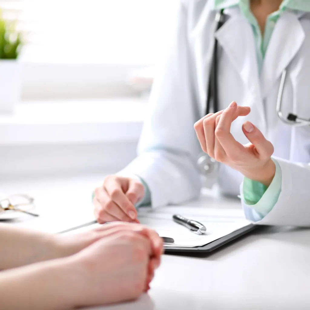 Doctor assessment in clinic with naturopath