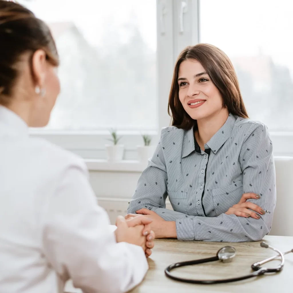 Woman smiling during naturopathic doctor appointment