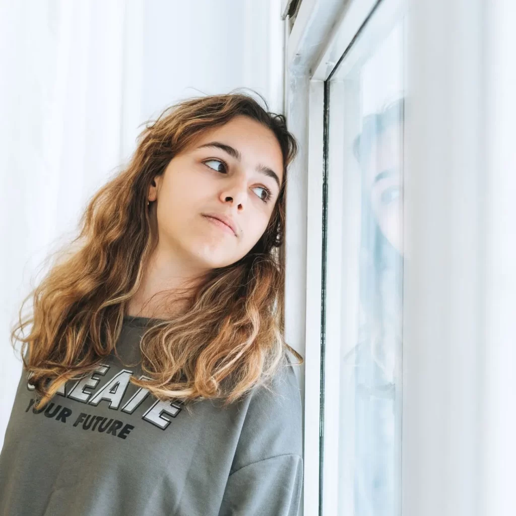 woman with anxiety looking outside