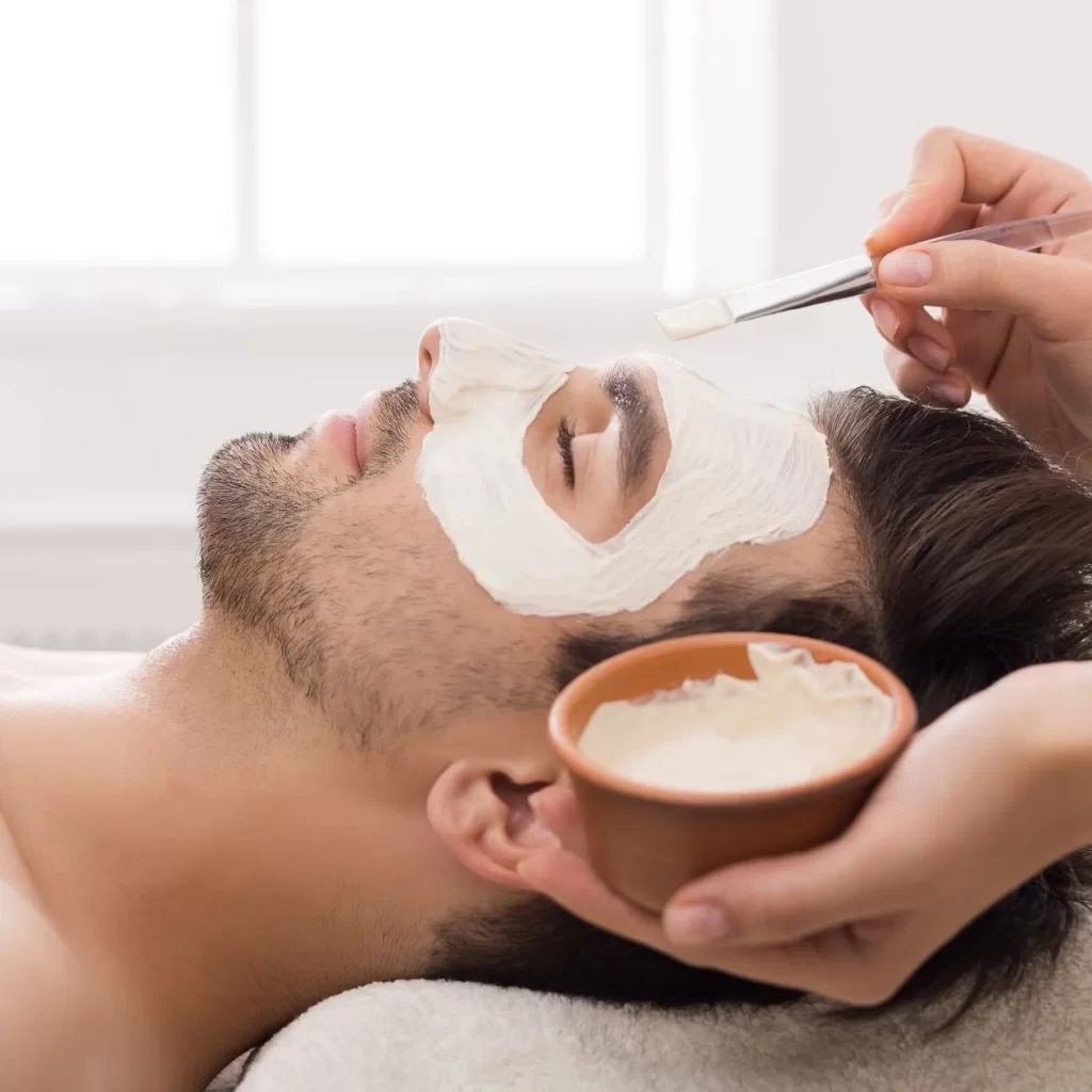 hand applying cream during professional facial