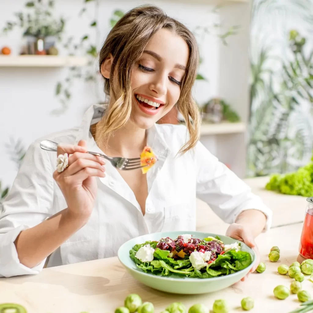 holistic nutritionist eating a healthy meal