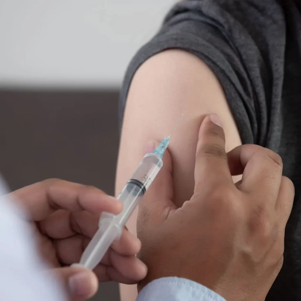 immunization shot being put in arm