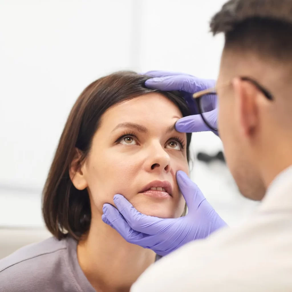 lady having eye emergency examined by a doctor