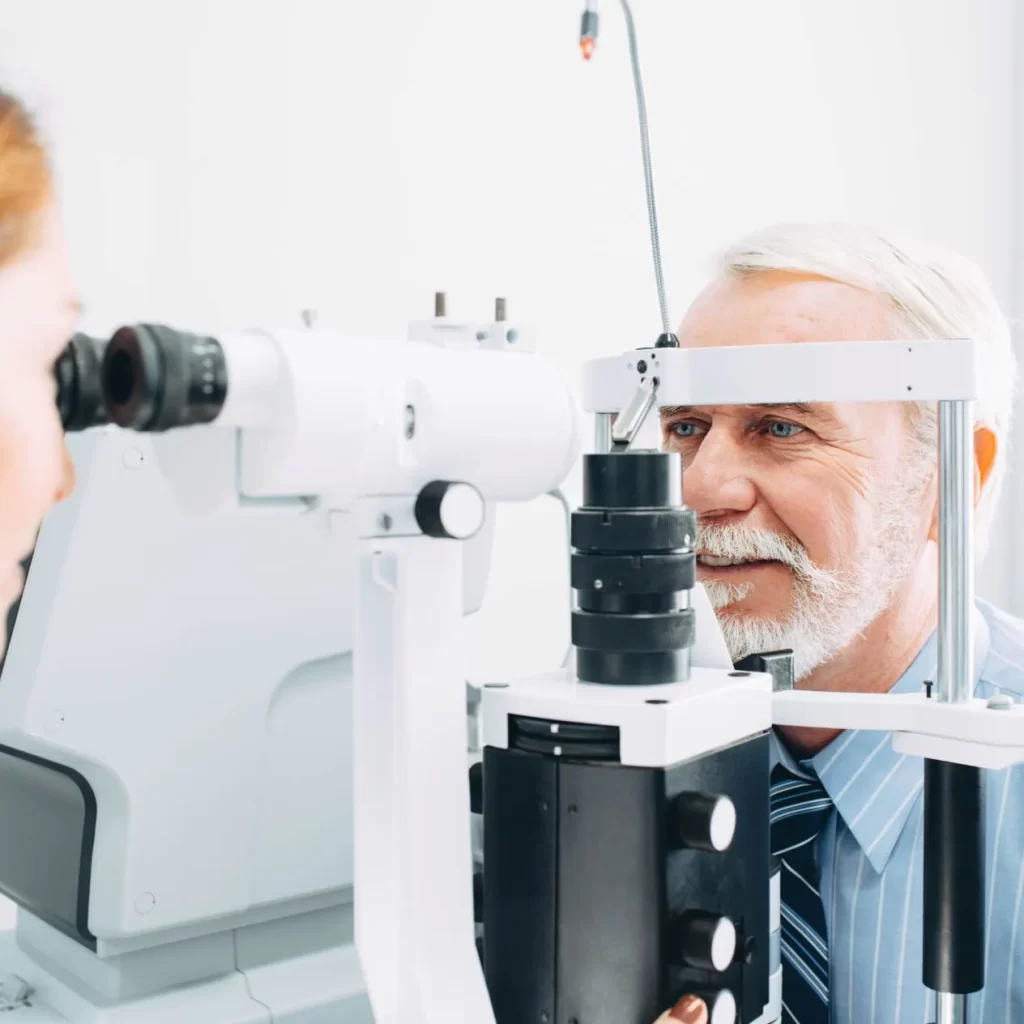 man having retinal scan done by optometrist