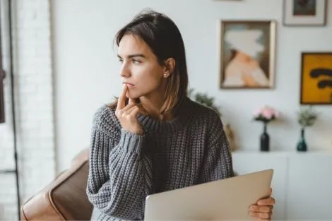 woman thinking about choosing a family doctor