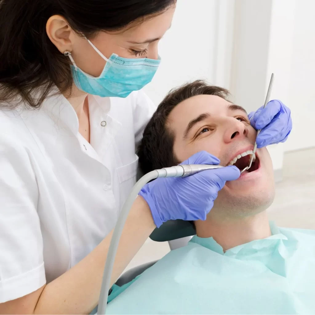 Dentist performing examination on patient
