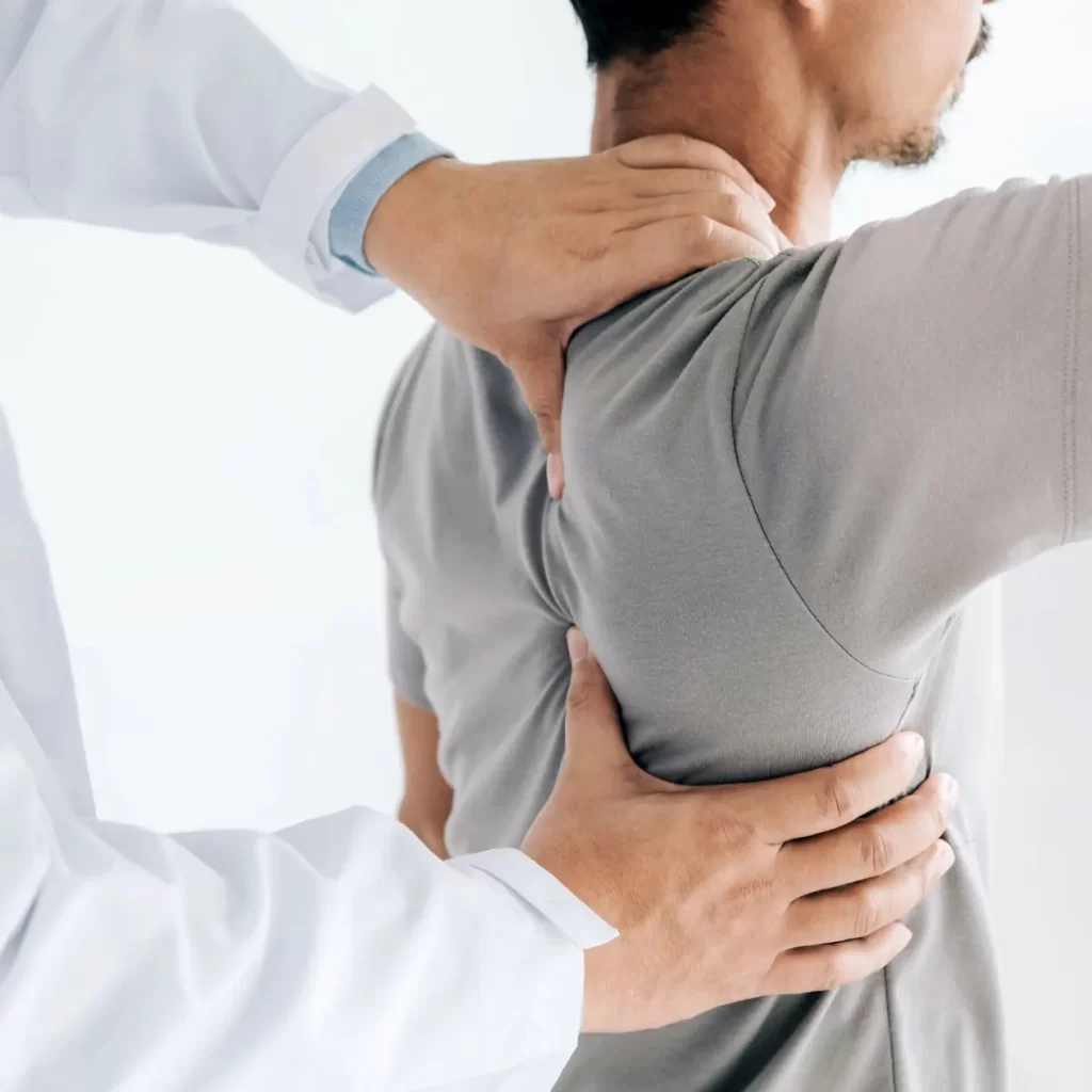 chiropractor treating back injury on a patient