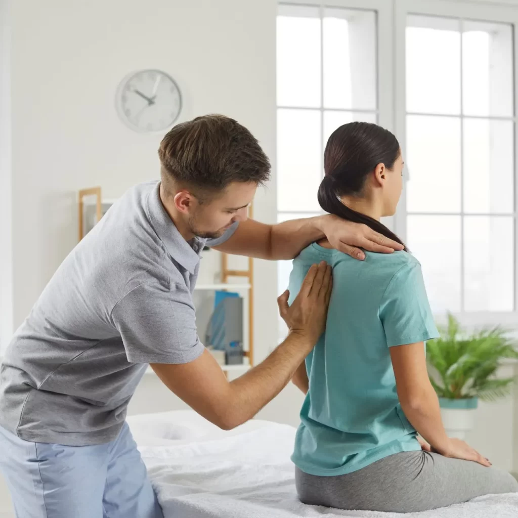 osteopath treating patient with hands on approach