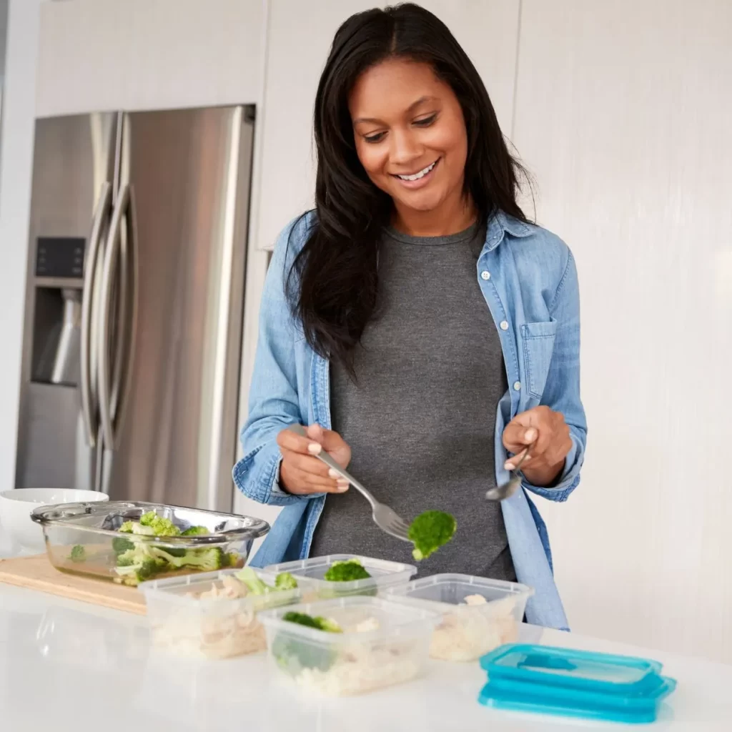 woman prepping healthy meals from dietitian
