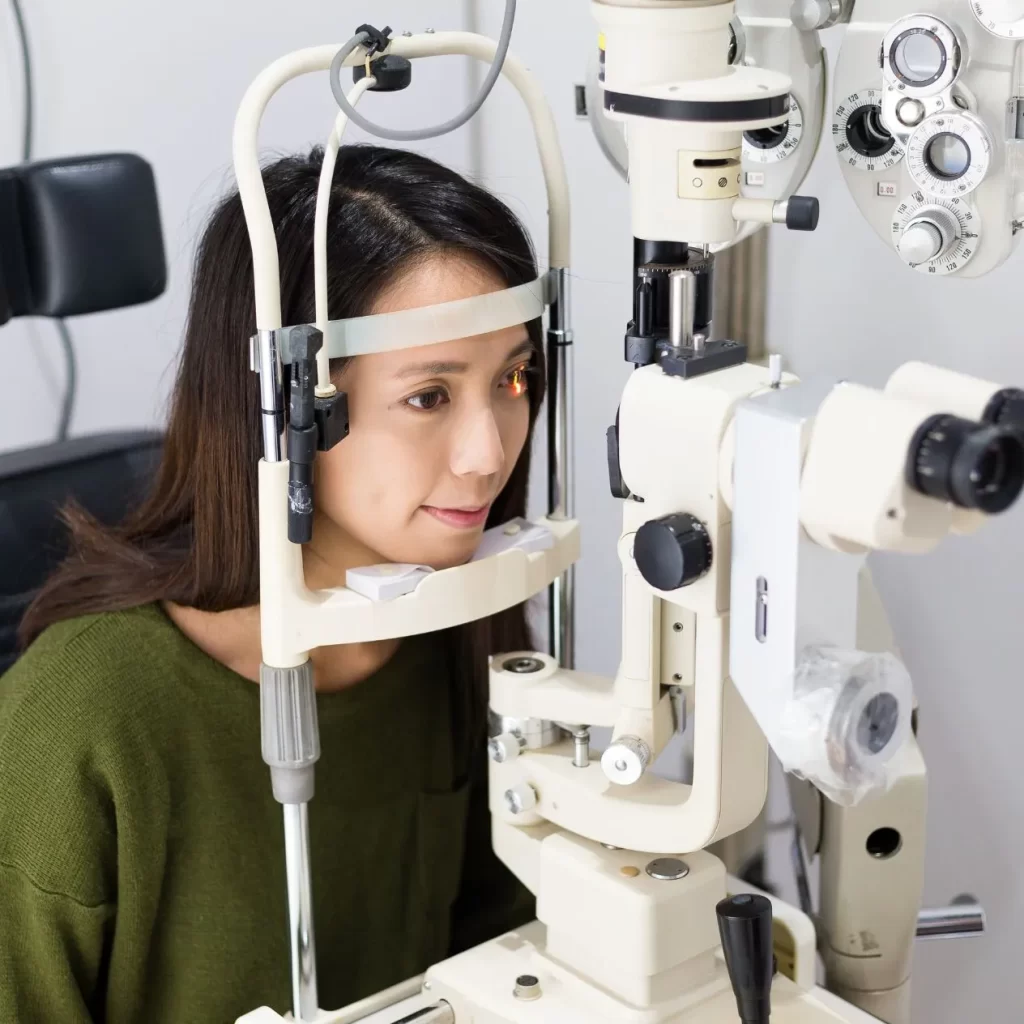 woman in eye examination with optometrist