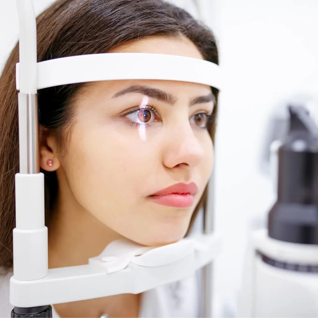 woman getting retinal scan at optometrist