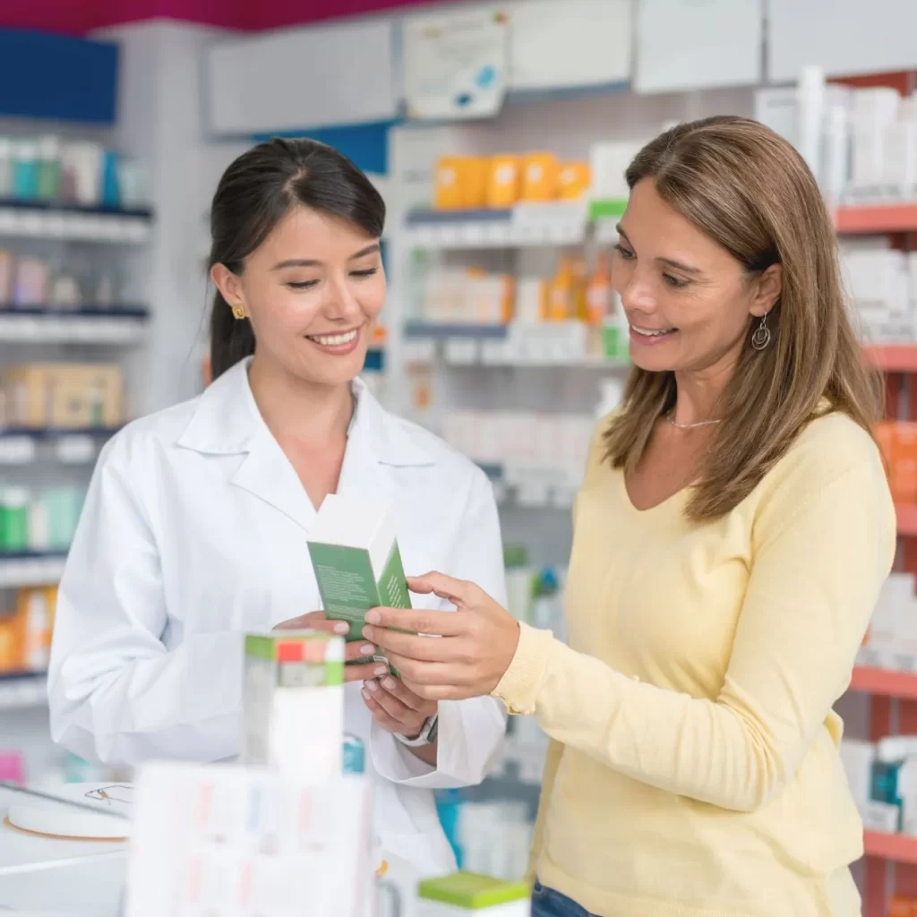 Pharmacist treating minor ailment at a pharmacy