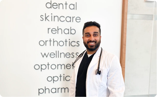 doc smiling in front of range of services