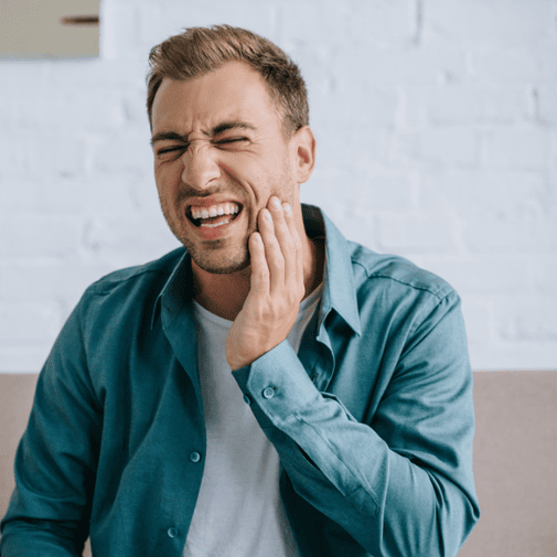 patient suffering from severe tooth ache needing tooth canal