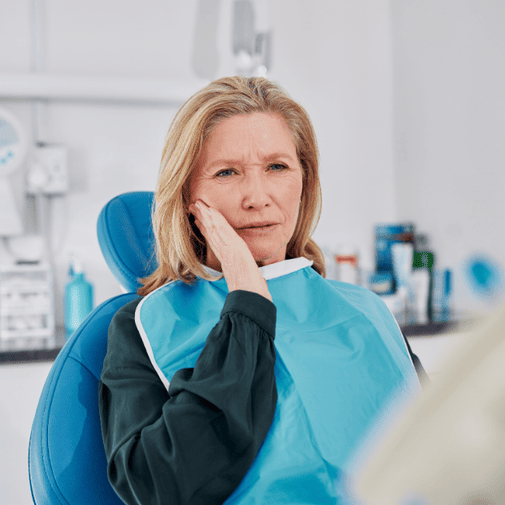 patient at dentist to fix broken and chipped tooth