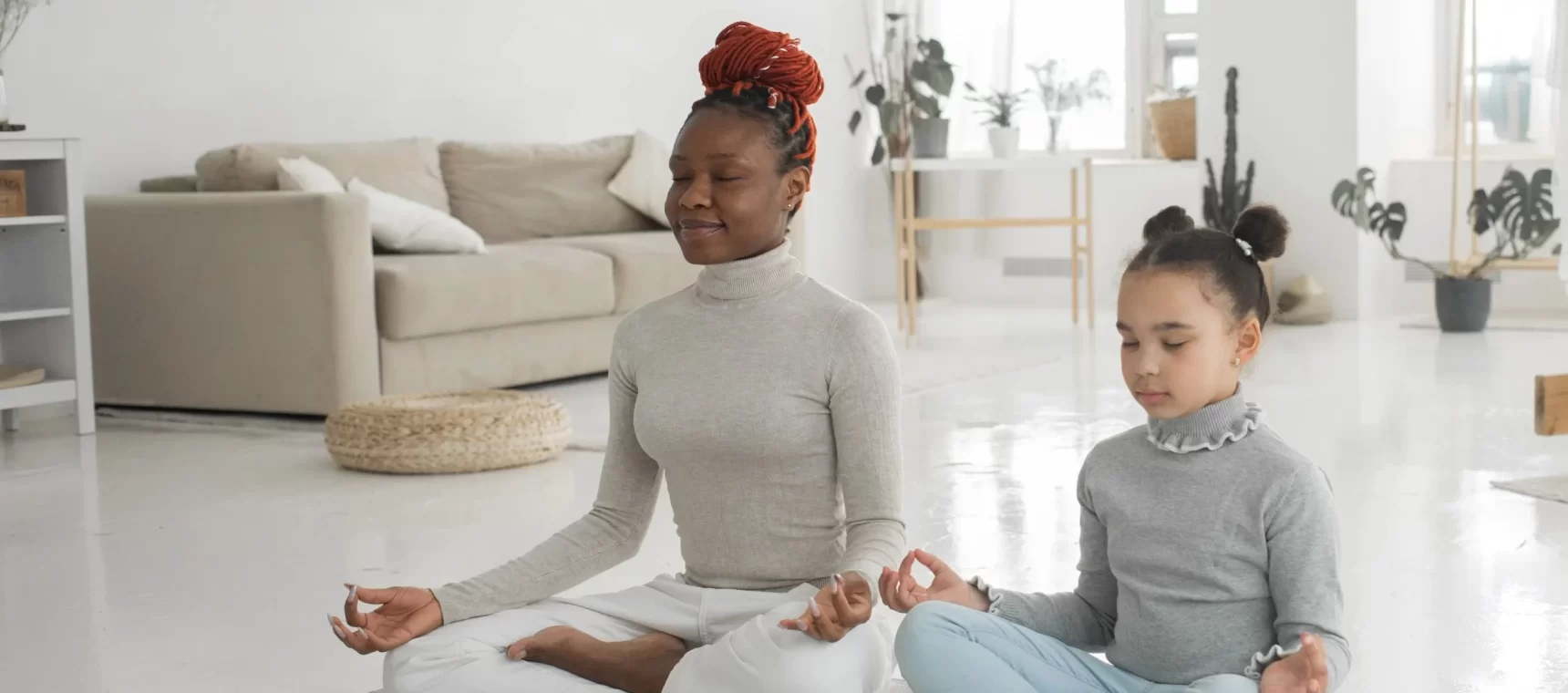 Mother & Daughter doing meditation to improve mind health